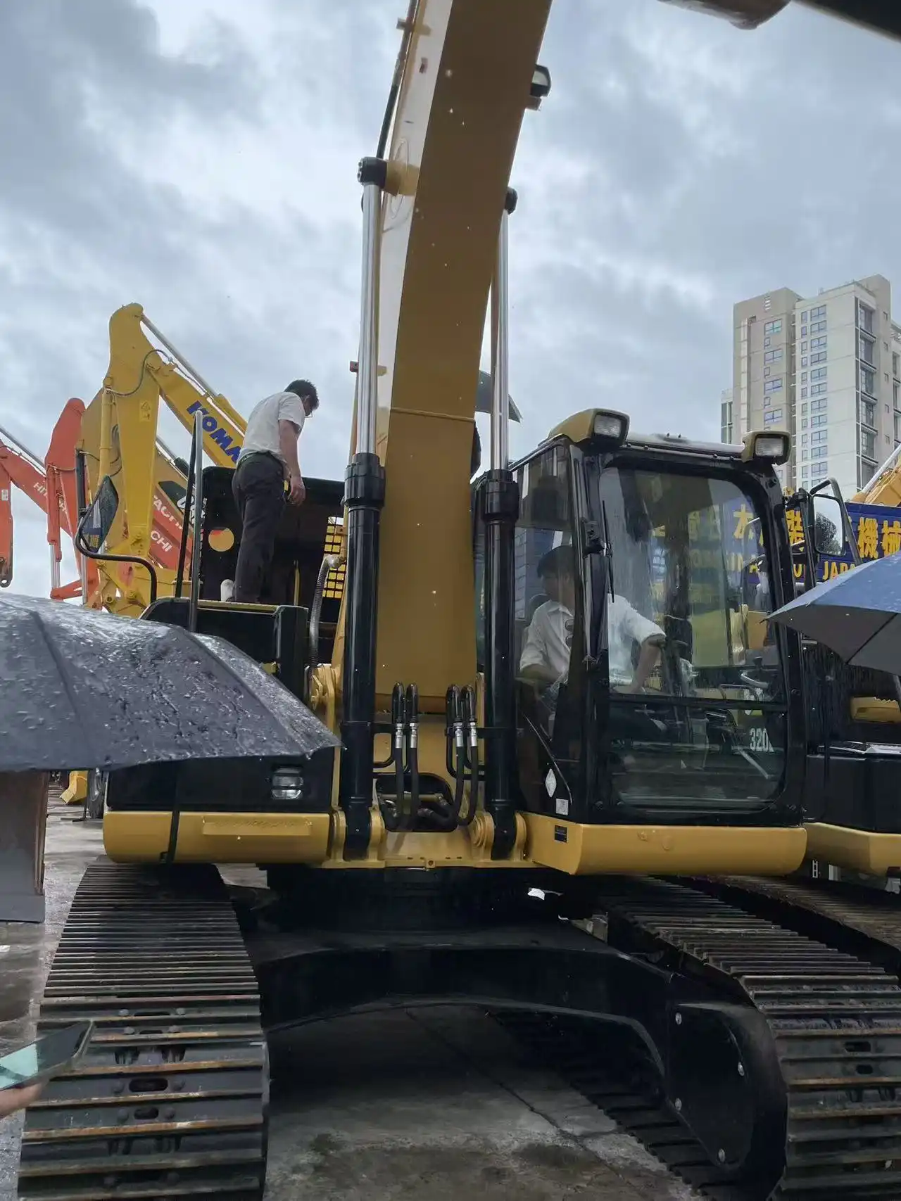 African Client Checks and Tests Equipment in the Rain